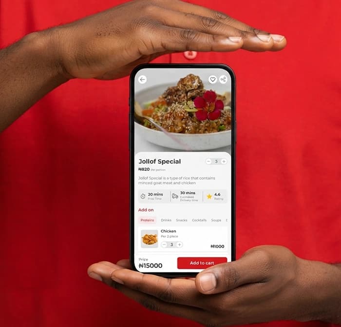 Hands holding phone showing Yummy You app